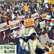 Demonstrators hold placards as more than 1,000 people rallied and later marched in downtown Hong Kong on Sunday, Jan. 23, 2005, to demand full democracy and social justice in the Chinese territory. The protesters chanted: "Direct elections in 2007 and 2008", the years in which Hong Kong is due a to get new leader and legislature. This former British colony was handed over to Chinese rule in 1997 with a guarantee of democratic political rights that do not exist on the mainland, but many residents who want democracy say Beijing exerts too much control here. The Chinese characters on the placards read: "Direct elections in 2007-8", "Against the collusion between the government and businesses".